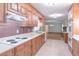 Open kitchen with plentiful cabinet space, smooth countertops and a stove at 4077 Phils Ct, Tucker, GA 30084