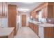 Traditional kitchen featuring wooden cabinets and neutral countertops at 4077 Phils Ct, Tucker, GA 30084
