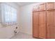 This laundry room has additional cabinet space at 4077 Phils Ct, Tucker, GA 30084