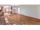 Spacious living room with hardwood floors, brick fireplace and view of kitchen and hall at 4077 Phils Ct, Tucker, GA 30084
