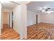 Bright living room featuring hard wood floors, ceiling fan, and neutral colored walls at 4077 Phils Ct, Tucker, GA 30084