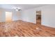 Open living room with hardwood floors leading to doorway, offering a flexible living space at 4077 Phils Ct, Tucker, GA 30084