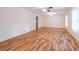 Spacious living room featuring hardwood floors, neutral colored walls, and a ceiling fan at 4077 Phils Ct, Tucker, GA 30084