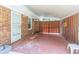 Covered patio features brick and a wooden fence at 4077 Phils Ct, Tucker, GA 30084