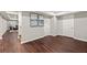 Finished basement area with wood flooring, neutral walls, and open layout at 4555 Holliston Rd, Dunwoody, GA 30360
