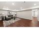 Basement living room with wood flooring, area rug, neutral paint, and recessed lighting at 4555 Holliston Rd, Dunwoody, GA 30360