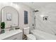 Renovated bathroom with white marble tiles, walk-in shower, soaking tub, and modern fixtures at 4555 Holliston Rd, Dunwoody, GA 30360