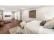 Large bedroom with a fireplace, hardwood floors, and modern decor at 4555 Holliston Rd, Dunwoody, GA 30360