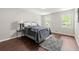 Bright bedroom with hardwood floors, and large windows providing plenty of natural light at 4555 Holliston Rd, Dunwoody, GA 30360