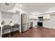 Modern kitchen with stainless steel appliances, white cabinets, and a built-in desk at 4555 Holliston Rd, Dunwoody, GA 30360