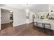 Open kitchen featuring white cabinets, stainless steel appliances, and a breakfast bar with seating at 4555 Holliston Rd, Dunwoody, GA 30360