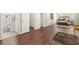 Spacious main bedroom with a connected bathroom, natural lighting, and hardwood flooring at 4555 Holliston Rd, Dunwoody, GA 30360