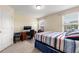 Bright bedroom with natural light, neutral walls, and plush carpet at 8295 Village Pl, Suwanee, GA 30024