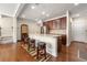 Eat in kitchen with barstool seating at kitchen island with granite countertops at 8295 Village Pl, Suwanee, GA 30024