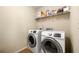 Practical laundry room with modern washer and dryer at 8295 Village Pl, Suwanee, GA 30024