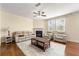 Comfortable living room boasts a fireplace and large windows at 8295 Village Pl, Suwanee, GA 30024