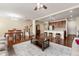 Open living space showcasing hardwood floors and seamless flow to the kitchen and dining area at 8295 Village Pl, Suwanee, GA 30024