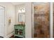 Stylish bathroom with a unique vanity, tiled shower, and decorative wall accents at 1140 River Laurel Dr, Suwanee, GA 30024