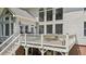 Spacious two-level wooden deck with white railing that offers additional outdoor living space at 1140 River Laurel Dr, Suwanee, GA 30024
