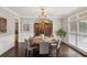 Formal dining room featuring a round table, hardwood floors, and chandelier at 1140 River Laurel Dr, Suwanee, GA 30024