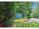 Well-maintained entrance sign for the River Laurel community with lush landscaping at 1140 River Laurel Dr, Suwanee, GA 30024