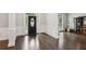 Warm and inviting foyer featuring dark hardwood floors and elegant wainscoting at 1140 River Laurel Dr, Suwanee, GA 30024