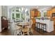 Open-concept kitchen with a view of the breakfast nook, featuring granite countertops and stainless appliances at 1140 River Laurel Dr, Suwanee, GA 30024