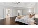 Large main bedroom featuring a tray ceiling, lots of windows, and hardwood flooring at 1140 River Laurel Dr, Suwanee, GA 30024