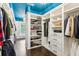 Large walk-in closet with custom shelving and ample storage for clothing and accessories at 1140 River Laurel Dr, Suwanee, GA 30024