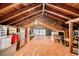 The spacious unfinished attic offers ample storage space with exposed wood beams at 2221 Fairoaks Rd, Decatur, GA 30033