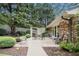 The wood patio is an outdoor oasis with lush landscaping and a comfortable seating area at 2221 Fairoaks Rd, Decatur, GA 30033