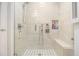 Modern bathroom boasting a walk-in shower with stylish tile and built-in bench at 2221 Fairoaks Rd, Decatur, GA 30033