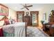 Charming bedroom featuring antique furnishings, hardwood floors, and natural light from large windows at 2221 Fairoaks Rd, Decatur, GA 30033