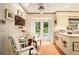 A breakfast nook with a table, chairs, and double glass doors leading to the outside at 2221 Fairoaks Rd, Decatur, GA 30033