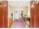 Inviting foyer showcasing hardwood floors, a stylish console table, and a glimpse into the spacious layout at 2221 Fairoaks Rd, Decatur, GA 30033