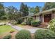 Charming brick home with a welcoming front entrance, featuring a well-manicured garden and walkway at 2221 Fairoaks Rd, Decatur, GA 30033