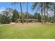 Classic brick home with a well-maintained lawn and mature trees, offering great curb appeal at 2221 Fairoaks Rd, Decatur, GA 30033