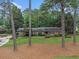 Traditional brick home with lush lawn and mature trees, showcasing its timeless elegance at 2221 Fairoaks Rd, Decatur, GA 30033
