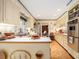 Traditional kitchen with tile floor, cream colored cabinets, and stainless steel appliances at 2221 Fairoaks Rd, Decatur, GA 30033