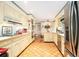 Traditional kitchen with tile floors, cream cabinets, and stainless appliances at 2221 Fairoaks Rd, Decatur, GA 30033