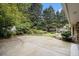 Back patio with ample space and lush landscaping at 2221 Fairoaks Rd, Decatur, GA 30033