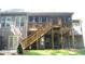 Backyard featuring a deck with stairs, a patio, and green grass at 4241 Hampton Mill Pkwy, Douglasville, GA 30135