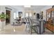 Entertainment area featuring a bar with stools, a dining table, and a view into the theater room at 4241 Hampton Mill Pkwy, Douglasville, GA 30135