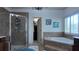 Well-appointed bathroom with a separate shower and soaking tub, plus tiled walls at 4241 Hampton Mill Pkwy, Douglasville, GA 30135