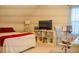 Bright bedroom with a work space, comfortable seating, and natural light at 4241 Hampton Mill Pkwy, Douglasville, GA 30135
