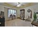 Bright bedroom with a ceiling fan, large window, and a well-organized bookshelf creating a comfortable and functional space at 4241 Hampton Mill Pkwy, Douglasville, GA 30135