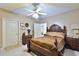 Bedroom featuring a ceiling fan, neutral walls, carpet, and wood furniture at 4241 Hampton Mill Pkwy, Douglasville, GA 30135