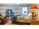 Cozy bedroom featuring patterned bedding, a TV, and comfortable seating at 4241 Hampton Mill Pkwy, Douglasville, GA 30135