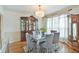 Traditional dining room boasting a beautiful china cabinet and hardwood floors at 4241 Hampton Mill Pkwy, Douglasville, GA 30135