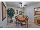 Dining room featuring a wooden table, carpet, and ceiling fan at 4241 Hampton Mill Pkwy, Douglasville, GA 30135